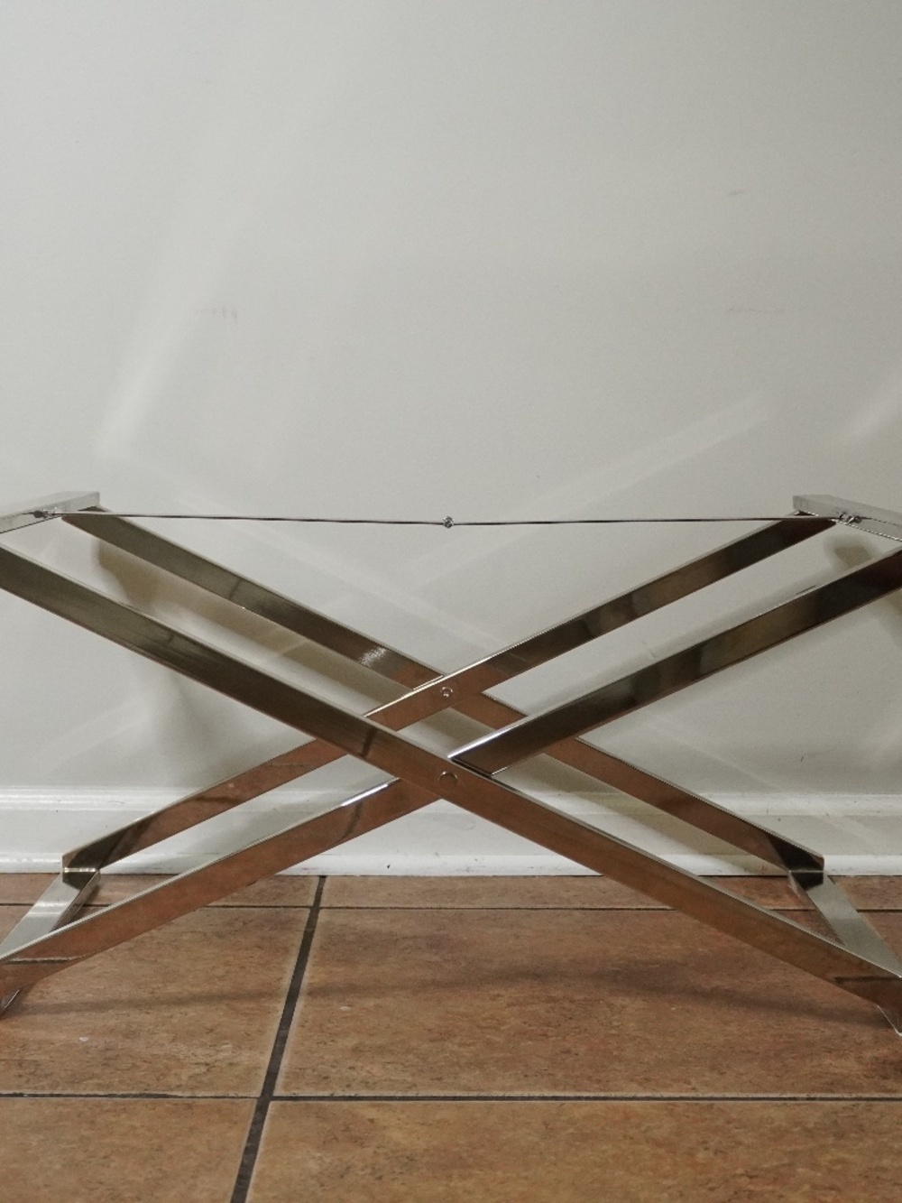 West Elm chrome tray table stand features a polished metal finish